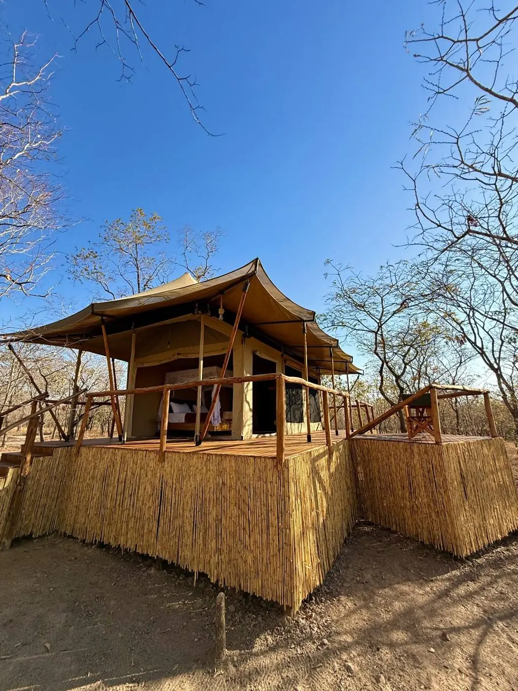 Luxury safari tent at Camp Lilac under a blue Mikumi sky